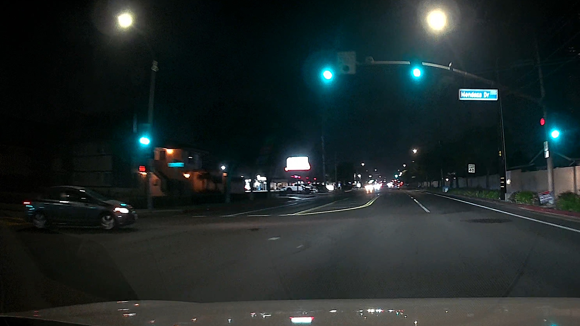 A car ran through a Red Light as captured by dash cam.